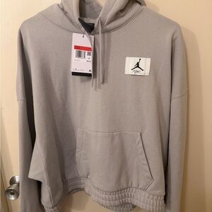 Nike Women's Light Gray Pullover Hoodie with Red Accent Tag